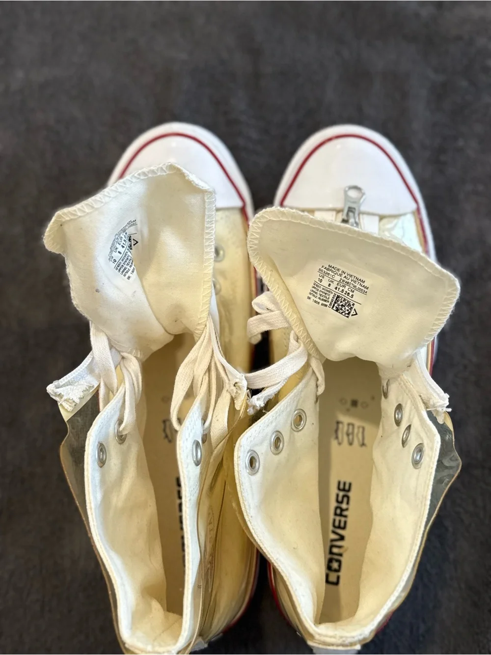 Converse white High Top Sneakers with vinyl zip cover.